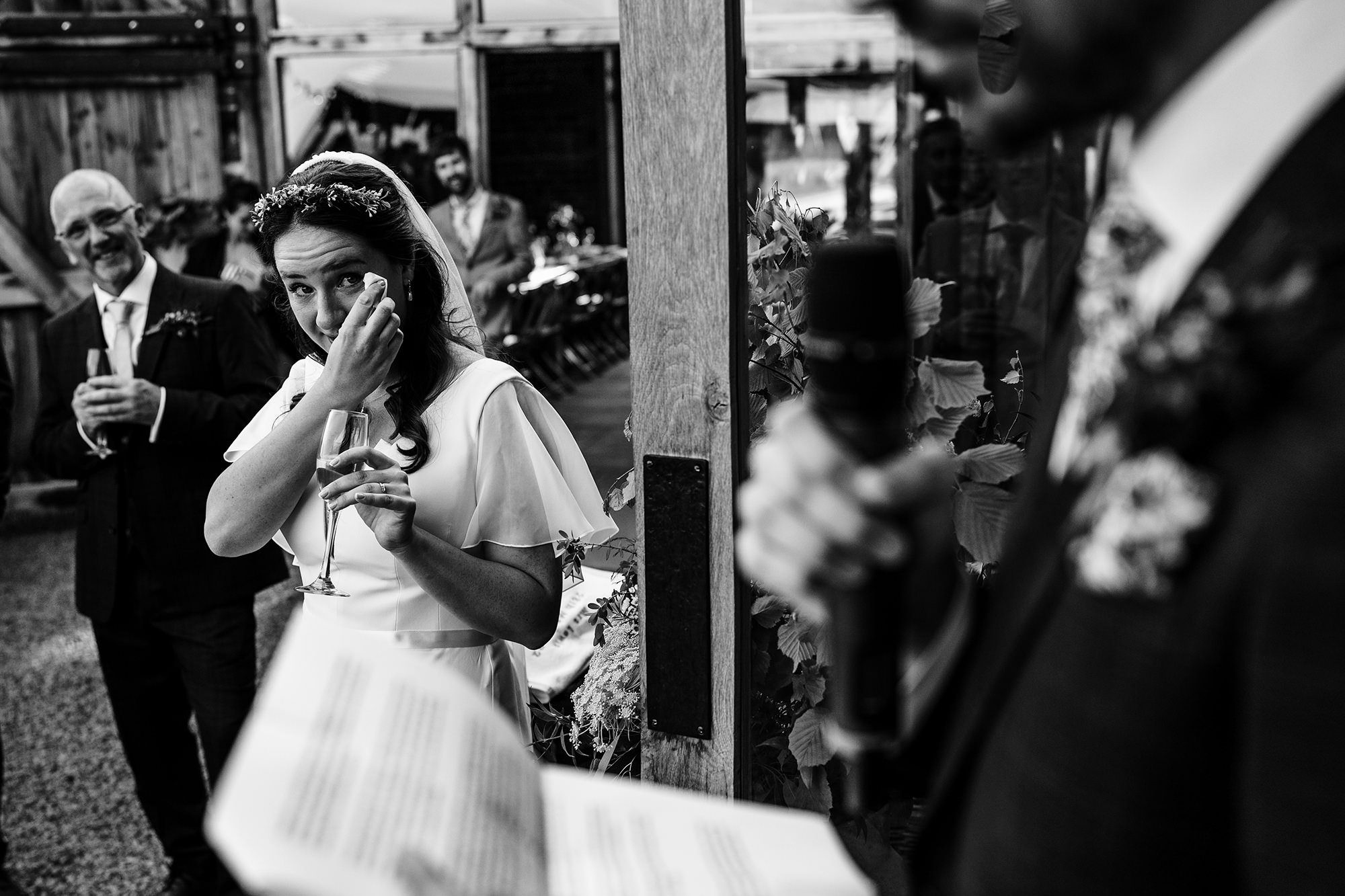 bride wipes tear in emotional moment at wedding