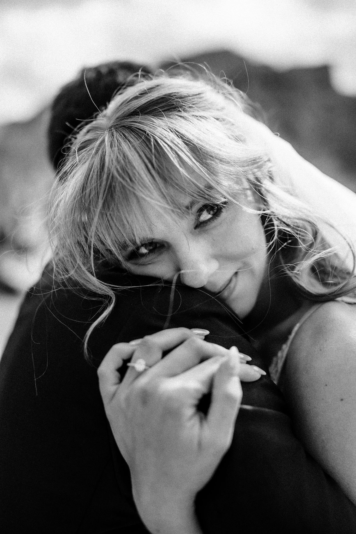 Couple hug after saying vows in Italy with photographer