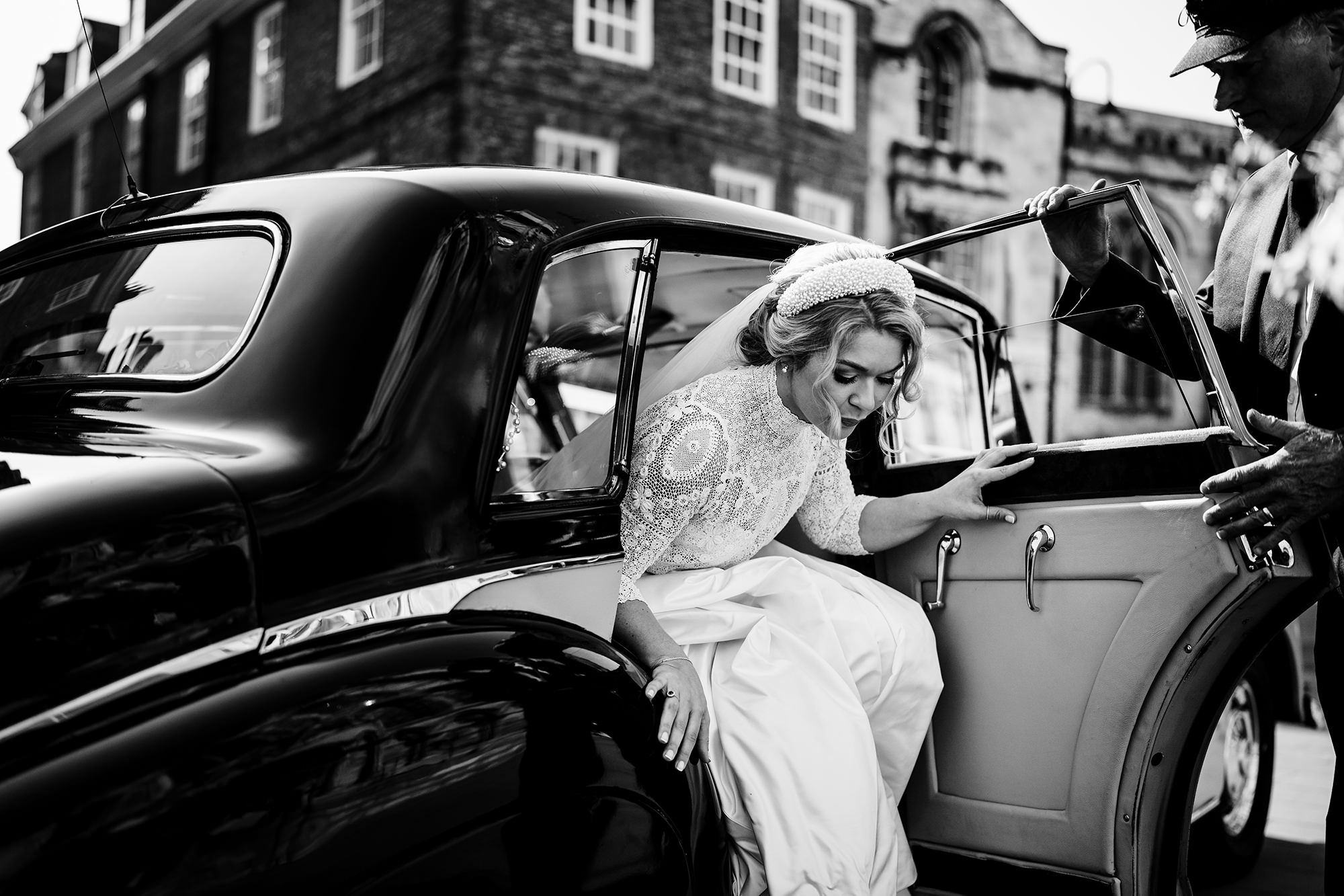 bride getting out of car in windermere