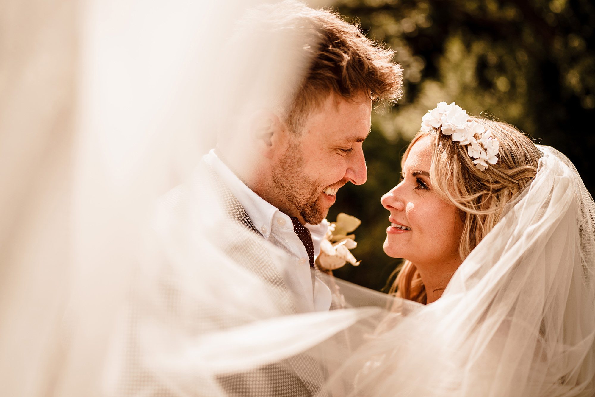 couple pose for photo in the lake district sunshine