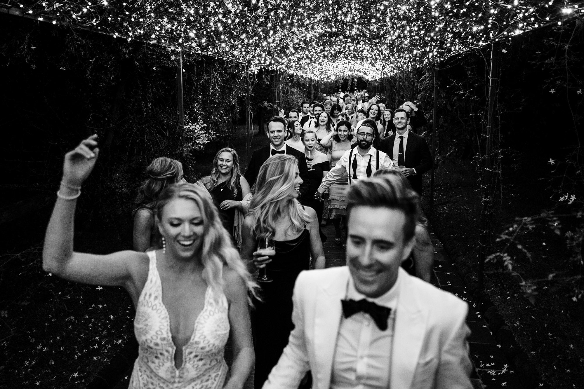 bride and groom posing for wedding photo in tuscany